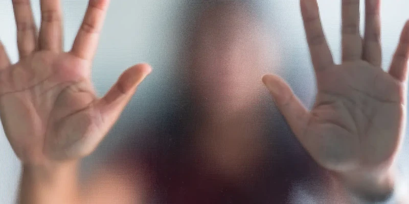 hands in front of window