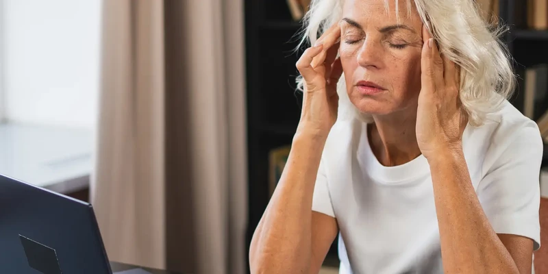 woman with hands on head