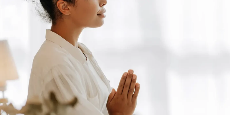 woman in white doing yoga